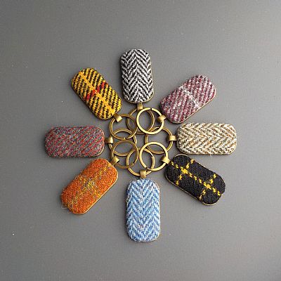 a colourful collection of harris tweed keyrings handmade at roses workshop