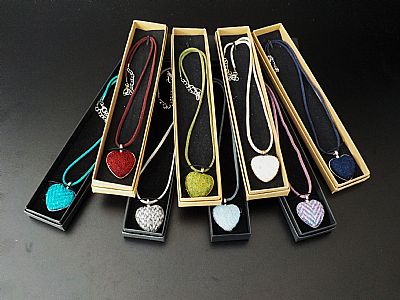 a colourful group of harris tweed necklaces handmade at roses workshop
