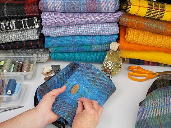 many colourful designs of harris tweed fabric made into lovely items at roses workshop studio